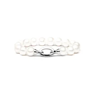Elegant pearl bracelet with a silver clasp, featuring lustrous white pearls in varying sizes arranged in a delicate design.